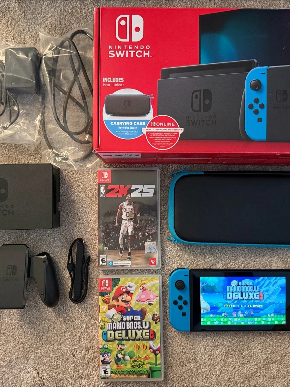 Nintendo Switch with Neon Blue Joy‑Con and Carry Case